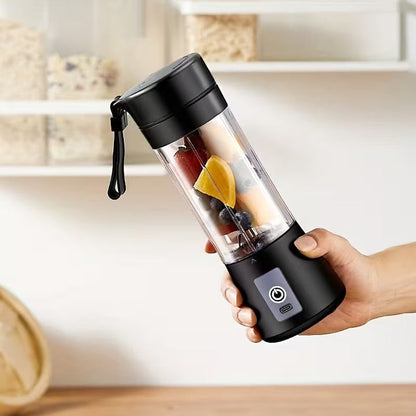 Mini portable USB electric blender and fruit juicer by Hausfiy, showing compact rechargeable blender with fruit inside.